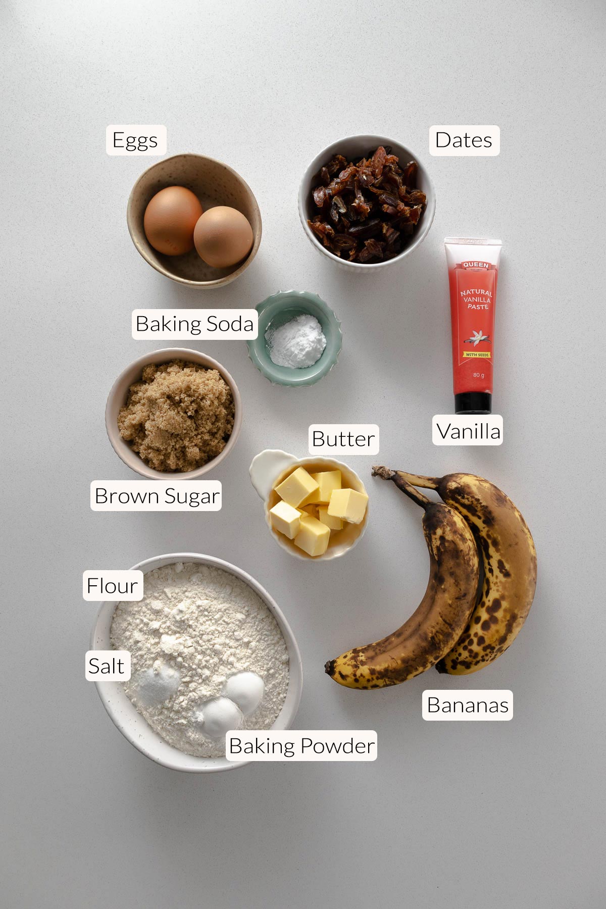Banana Date Loaf Ingredients - bananas, dates, vanilla, butter, baking powder, baking soda, flour, brown sugar, eggs.