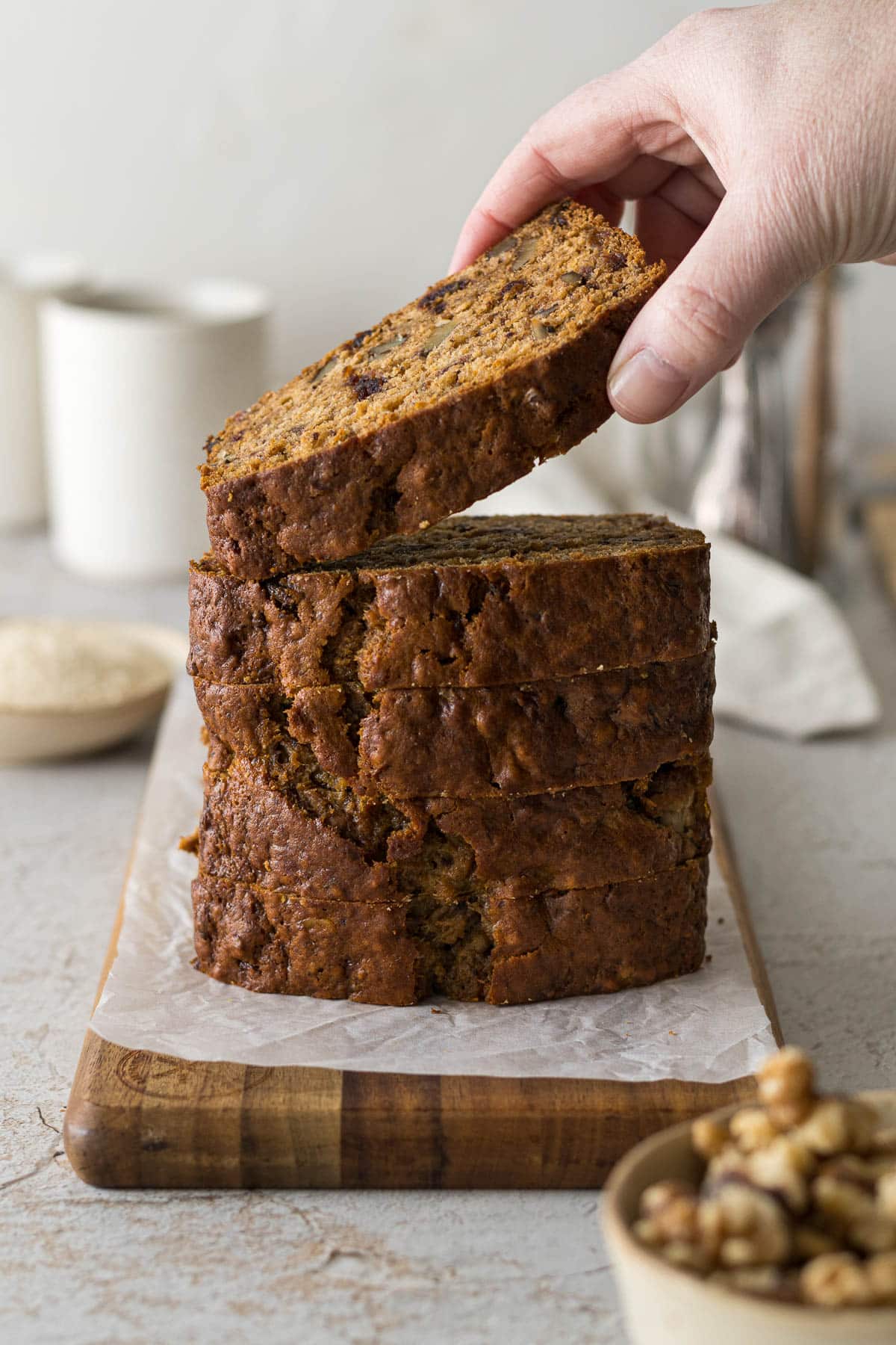 Stacked slices of date walnut and banana loaf.